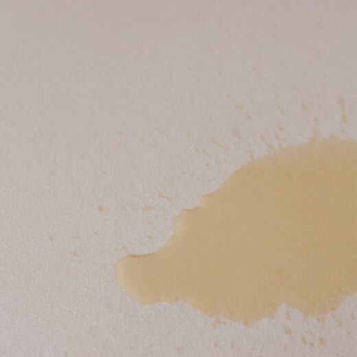Water spilled on waterproof mattress protector.