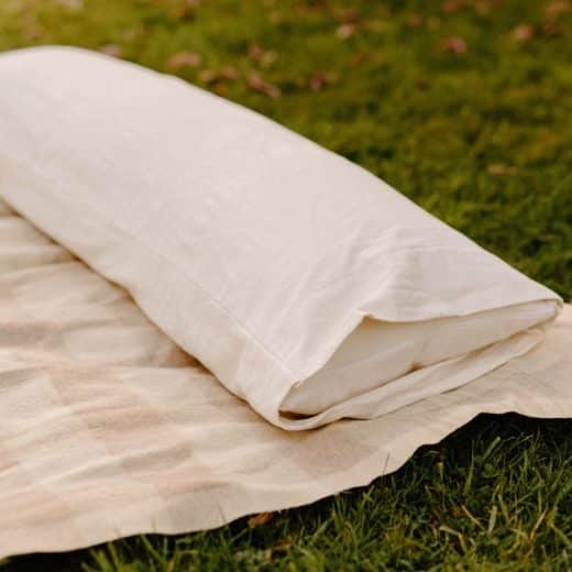 Organic Kapok Body Pillow - pillow on blanket outdoors