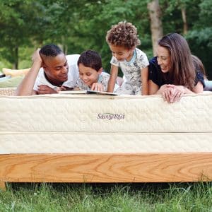 Family relaxing on Savvy Rest's Serenity organic mattress