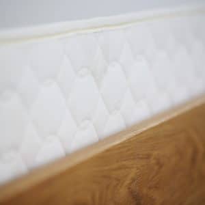 Savvy Rest Foundation in a wooden bed frame
