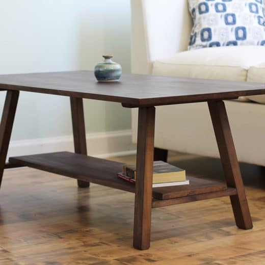 Natural hardwood coffee table with shelf in family room