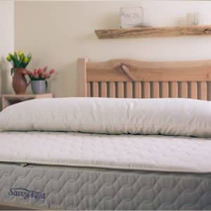 Shredded Latex Body Pillow - pillow laid out on Savvy Rest mattress
