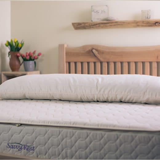 Shredded Latex Body Pillow - pillow laid out on Savvy Rest mattress