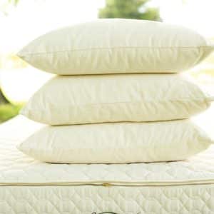 Organic wool pillow - three medium-firm pillows stacked on Savvy Rest mattress